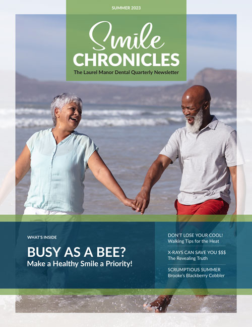 older couple laughing walking hand in hand on the beach